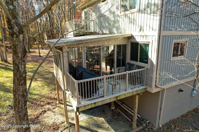 view of side of home featuring a deck