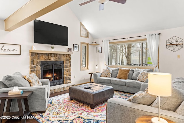 living area featuring ceiling fan, a fireplace, high vaulted ceiling, and wood finished floors