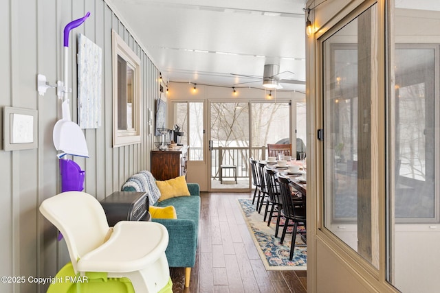 sunroom featuring a ceiling fan