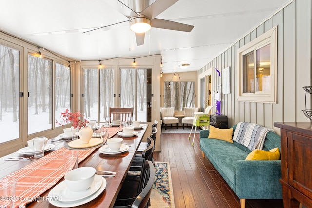 sunroom / solarium with a ceiling fan