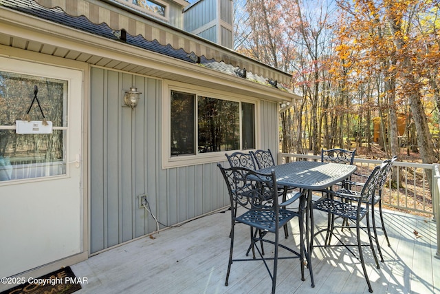 view of patio featuring a deck and outdoor dining area