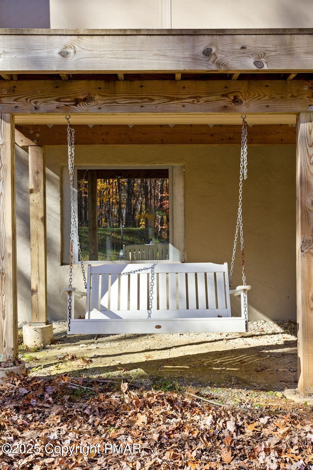 view of exterior entry featuring stucco siding