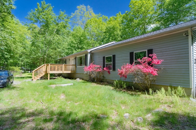 1206 Wooddale Rd, East Stroudsburg, PA 18302 - view of side of property with a wooden deck and a lawn