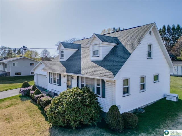 829 E Main St, Weatherly, PA 18255 - view of front of house featuring a garage, a front lawn, and a shingled roof