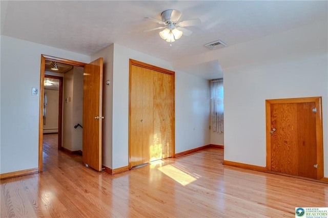 829 E Main St, Weatherly, PA 18255 - unfurnished bedroom with light wood finished floors, a baseboard radiator, and baseboards