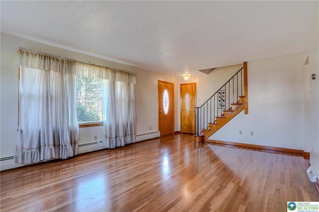 829 E Main St, Weatherly, PA 18255 - foyer with wood finished floors, stairs, baseboards, and a baseboard radiator