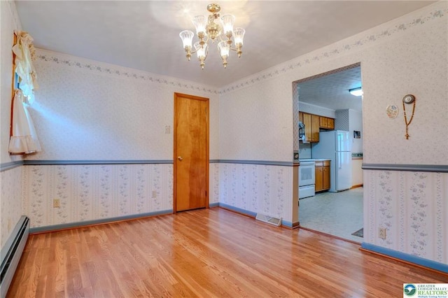 829 E Main St, Weatherly, PA 18255 - empty room featuring baseboard heating, light wood finished floors, wallpapered walls, a chandelier, and baseboards
