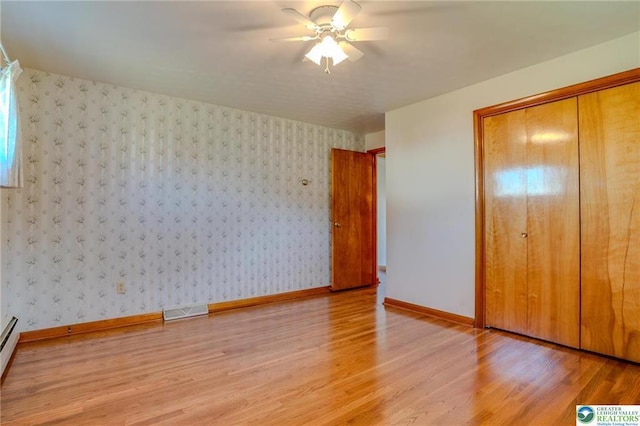 829 E Main St, Weatherly, PA 18255 - unfurnished bedroom featuring light wood-style flooring, baseboards, a closet, and ceiling fan
