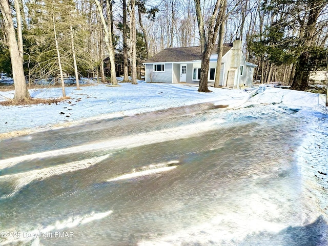 view of front of house featuring a chimney