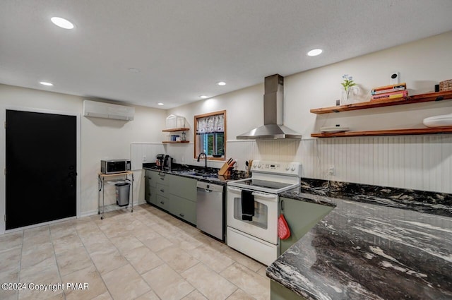 kitchen with a wall mounted AC, open shelves, a sink, appliances with stainless steel finishes, and wall chimney exhaust hood