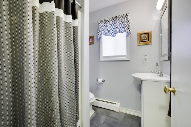 full bathroom featuring vanity, baseboards, tile patterned flooring, toilet, and baseboard heating