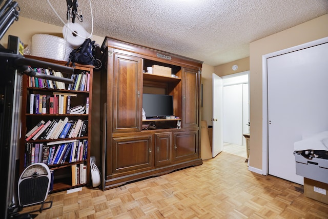 interior space with a textured ceiling