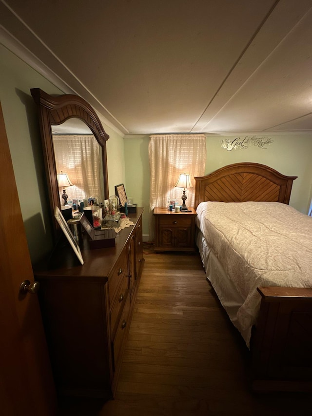 bedroom with wood finished floors