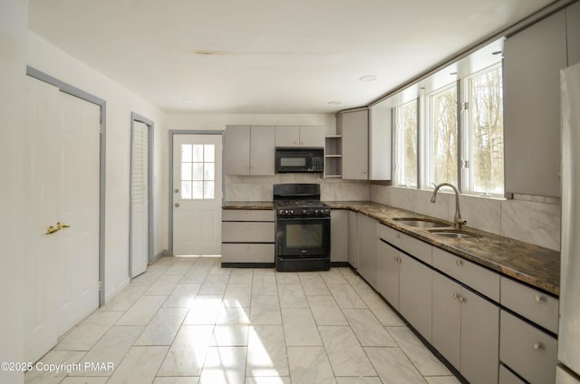 kitchen featuring sink, gray cabinetry, decorative backsplash, and black appliances