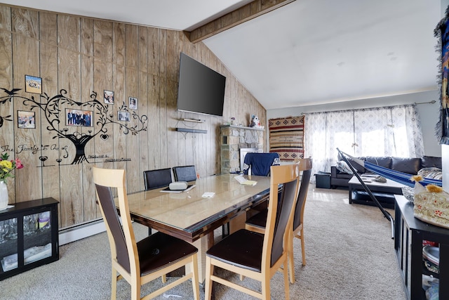 carpeted dining space featuring wooden walls, baseboard heating, and vaulted ceiling with beams