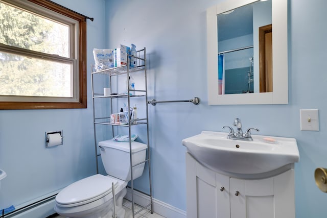 full bath featuring a baseboard heating unit, baseboards, toilet, and vanity