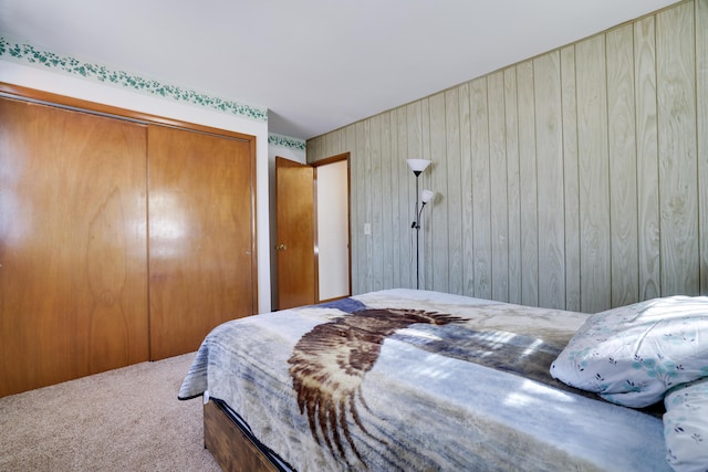 carpeted bedroom with a closet