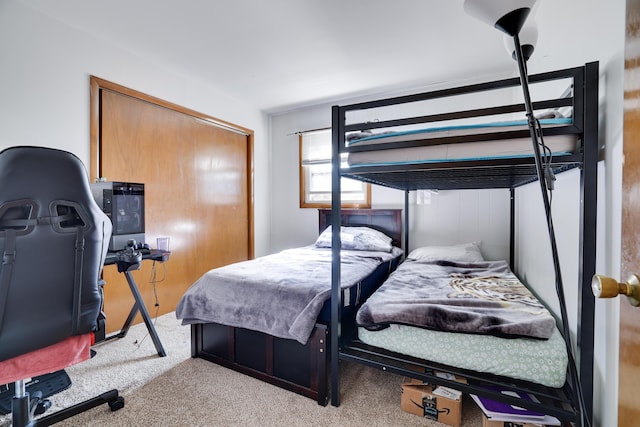 bedroom featuring a closet and carpet floors