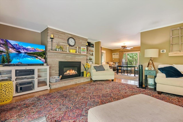 742 White Oak Rd, Cresco, PA 18326 - living room featuring wood finished floors, crown molding, a large fireplace, a ceiling fan, and a wall unit AC
