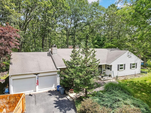 742 White Oak Rd, Cresco, PA 18326 - view of front of property with driveway, an attached garage, a chimney, and a shingled roof