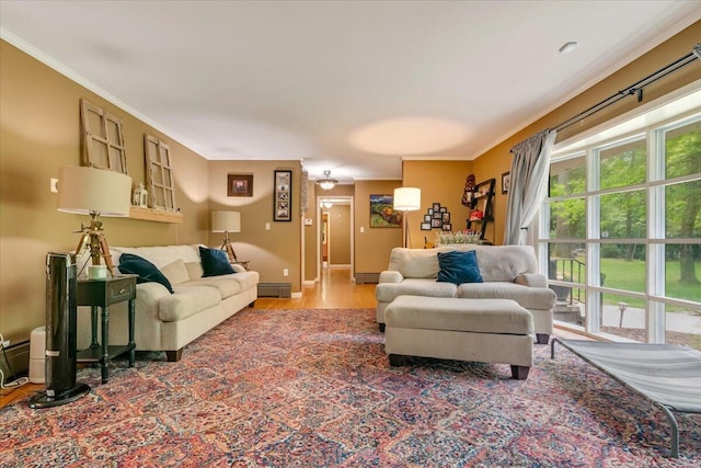 742 White Oak Rd, Cresco, PA 18326 - living area featuring wood finished floors, crown molding, and a baseboard heating unit