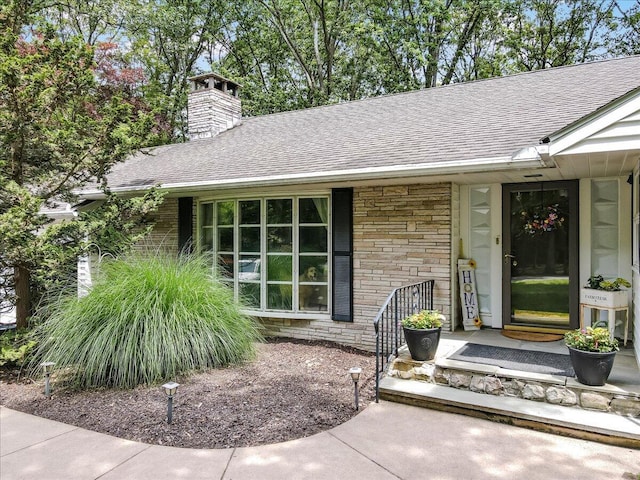 742 White Oak Rd, Cresco, PA 18326 - view of exterior entry featuring roof with shingles, a chimney, and a porch