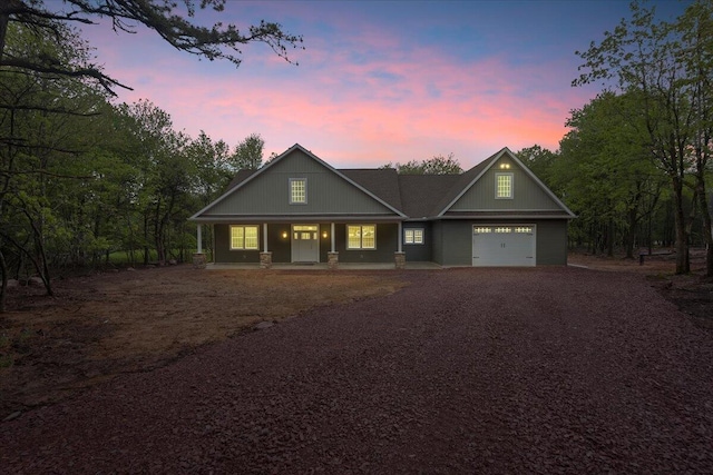 111 Parker Mews, Albrightsville, PA 18210 - view of front of house with covered porch, dirt driveway, and a garage
