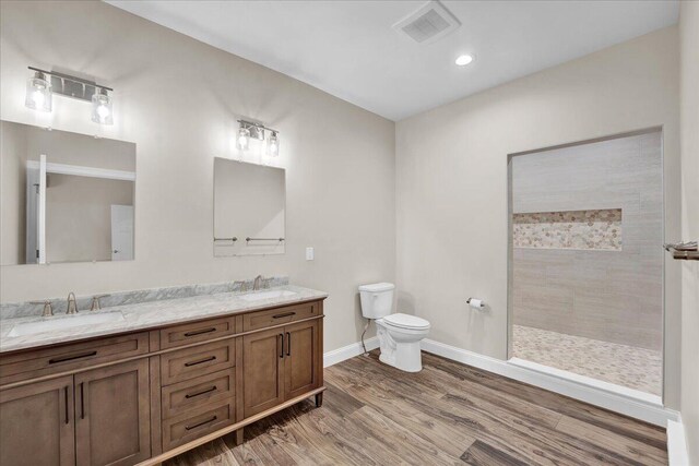 111 Parker Mews, Albrightsville, PA 18210 - full bath with double vanity, toilet, wood finished floors, baseboards, and walk in shower