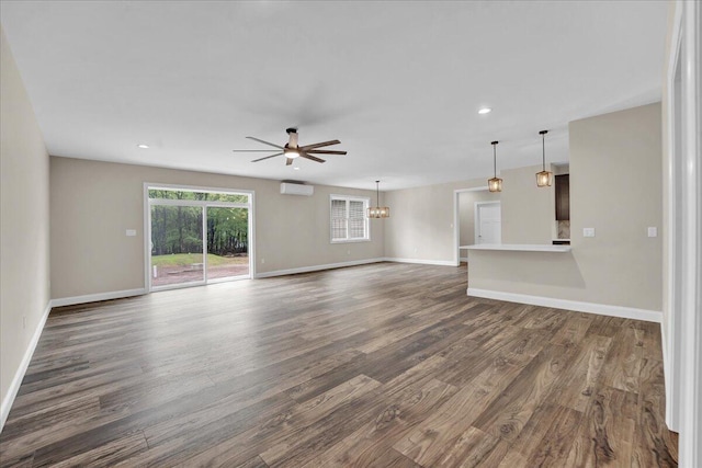 111 Parker Mews, Albrightsville, PA 18210 - unfurnished living room featuring dark wood-style floors, baseboards, ceiling fan, a chandelier, and recessed lighting