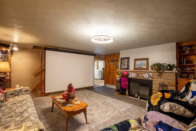 7035 Scenic Dr, Bloomsburg, PA 17815 - home theater featuring a fireplace, wood finished floors, and a baseboard heating unit