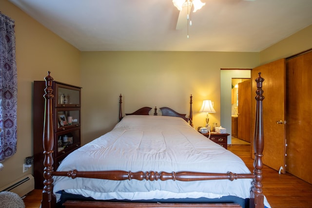 7035 Scenic Dr, Bloomsburg, PA 17815 - bedroom with baseboard heating and wood finished floors