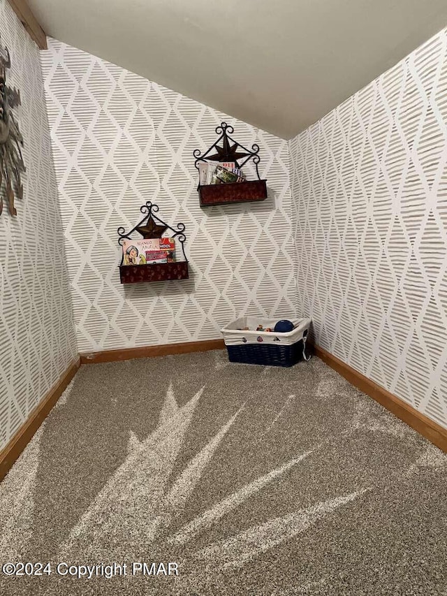 mudroom featuring baseboards, carpet floors, and wallpapered walls