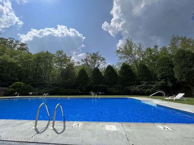 pool featuring a patio area