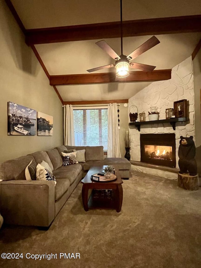 carpeted living area featuring lofted ceiling with beams, ceiling fan, and a stone fireplace