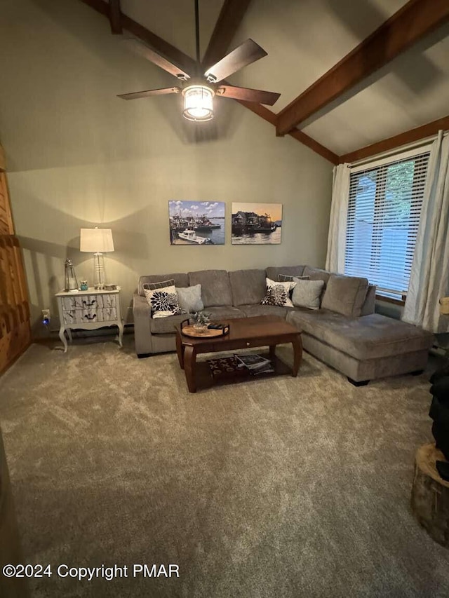 carpeted living area with high vaulted ceiling, a ceiling fan, and beamed ceiling