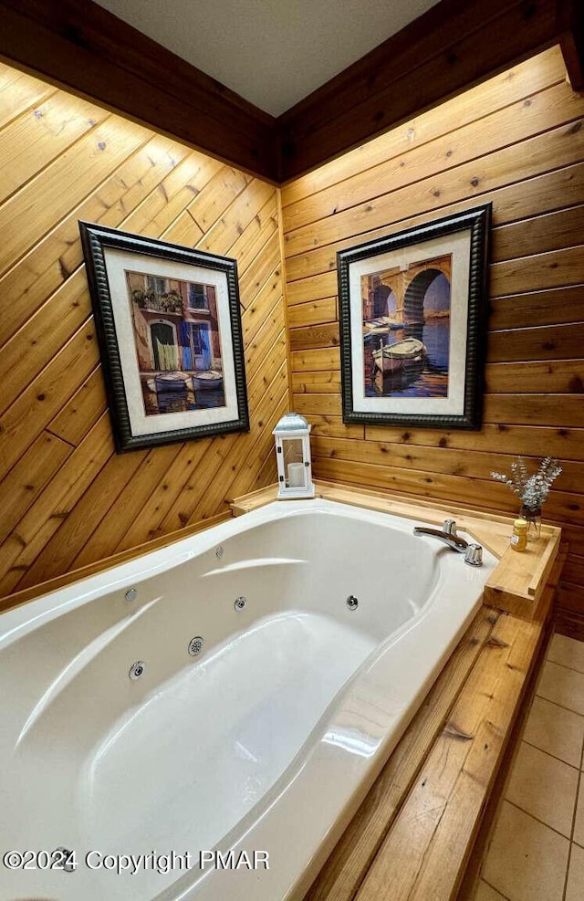 full bathroom featuring a jetted tub and tile patterned flooring