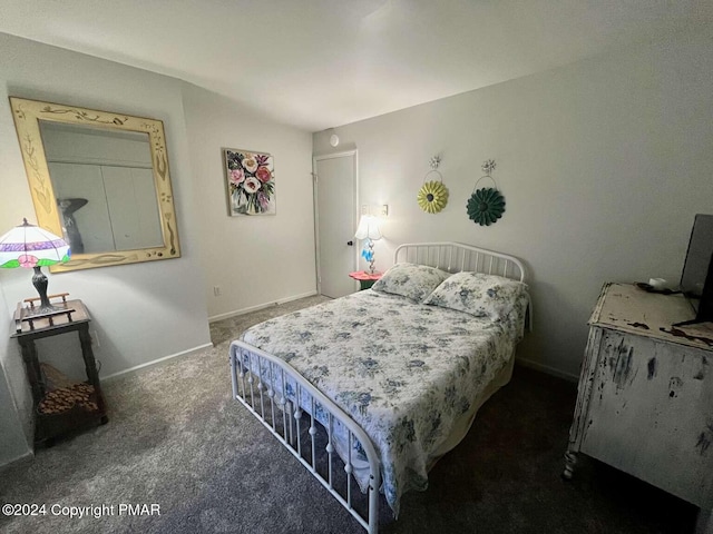 carpeted bedroom featuring baseboards