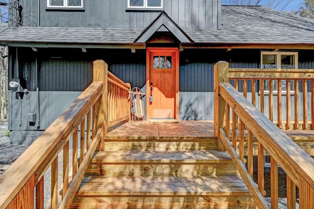 5256 Woodland Ave, Pocono Pines, PA 18350 - property entrance featuring a shingled roof and a deck