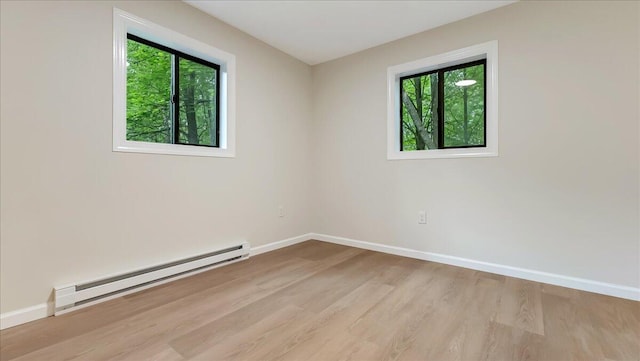 148 Acorn Ln, Kunkletown, PA 18058 - empty room featuring baseboard heating, plenty of natural light, and wood finished floors