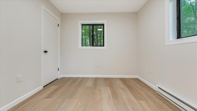 148 Acorn Ln, Kunkletown, PA 18058 - unfurnished bedroom featuring a baseboard radiator and light wood-style floors
