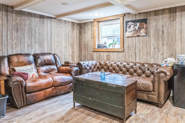 living room featuring wood walls, beamed ceiling, and wood finished floors