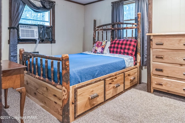 carpeted bedroom featuring cooling unit and crown molding