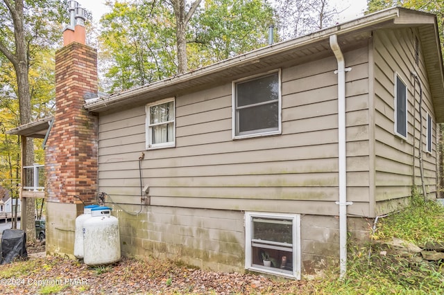 view of home's exterior with a chimney