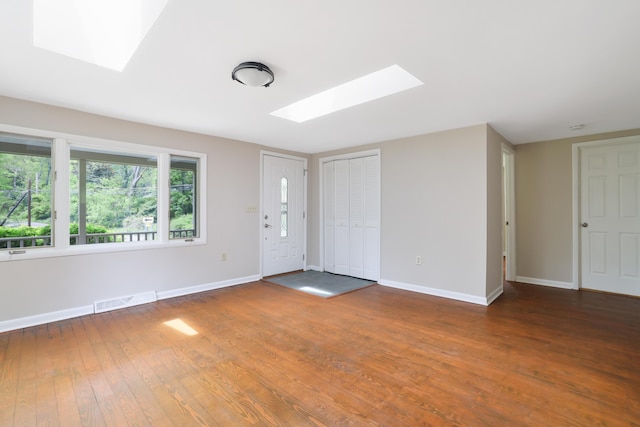157 Hollow Rd, East Stroudsburg, PA 18302 - foyer entrance featuring a skylight, baseboards, and wood finished floors