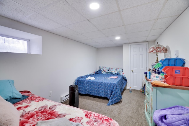 bedroom with carpet floors, a paneled ceiling, a baseboard radiator, and recessed lighting