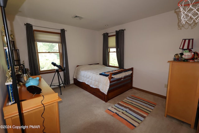 bedroom featuring visible vents, baseboards, and carpet flooring