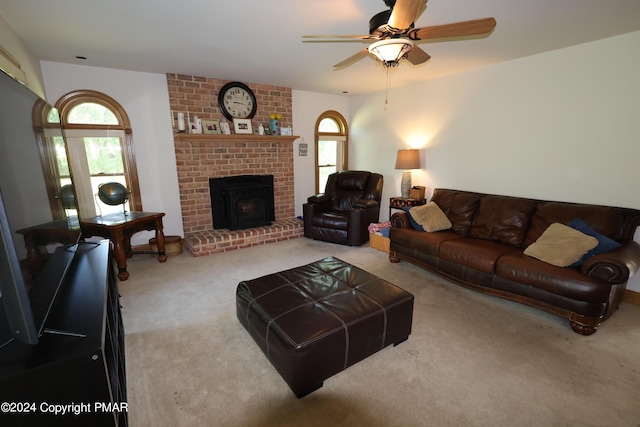 carpeted living area featuring ceiling fan