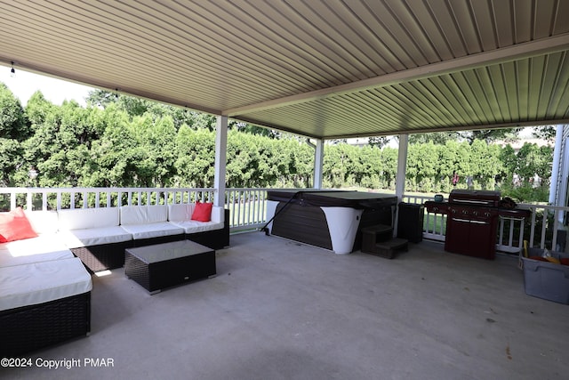 view of patio with outdoor lounge area and a hot tub