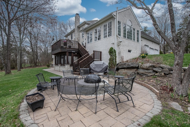 117 Morning Side Ter, East Stroudsburg, PA 18302 - back of property with a fire pit, stairway, a chimney, and a patio