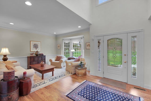 117 Morning Side Ter, East Stroudsburg, PA 18302 - foyer entrance featuring crown molding, wood finished floors, visible vents, and a healthy amount of sunlight